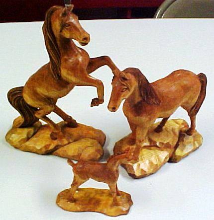 Don Hunt's Wild horses woodcarvings